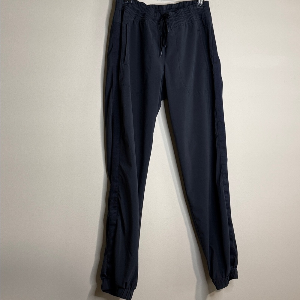 Athleta joggers in black size 4 with tuxedo stripe down legs